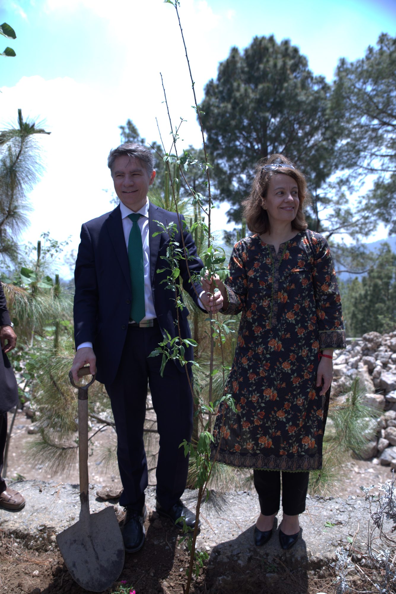 Guests planting a tree in the pine grove at Yaldram Resort