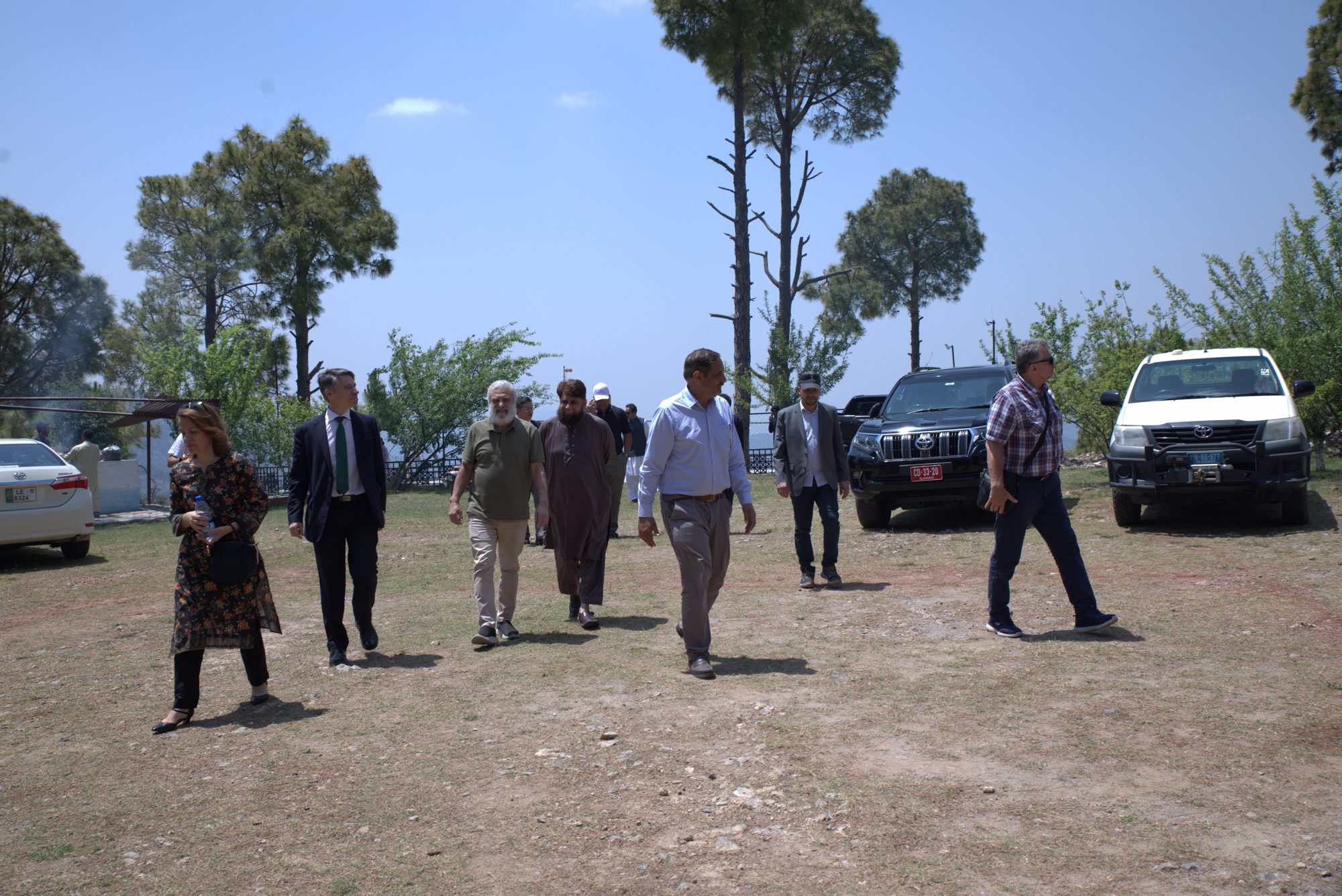A group of guests walking the open grounds at Yaldram Resort